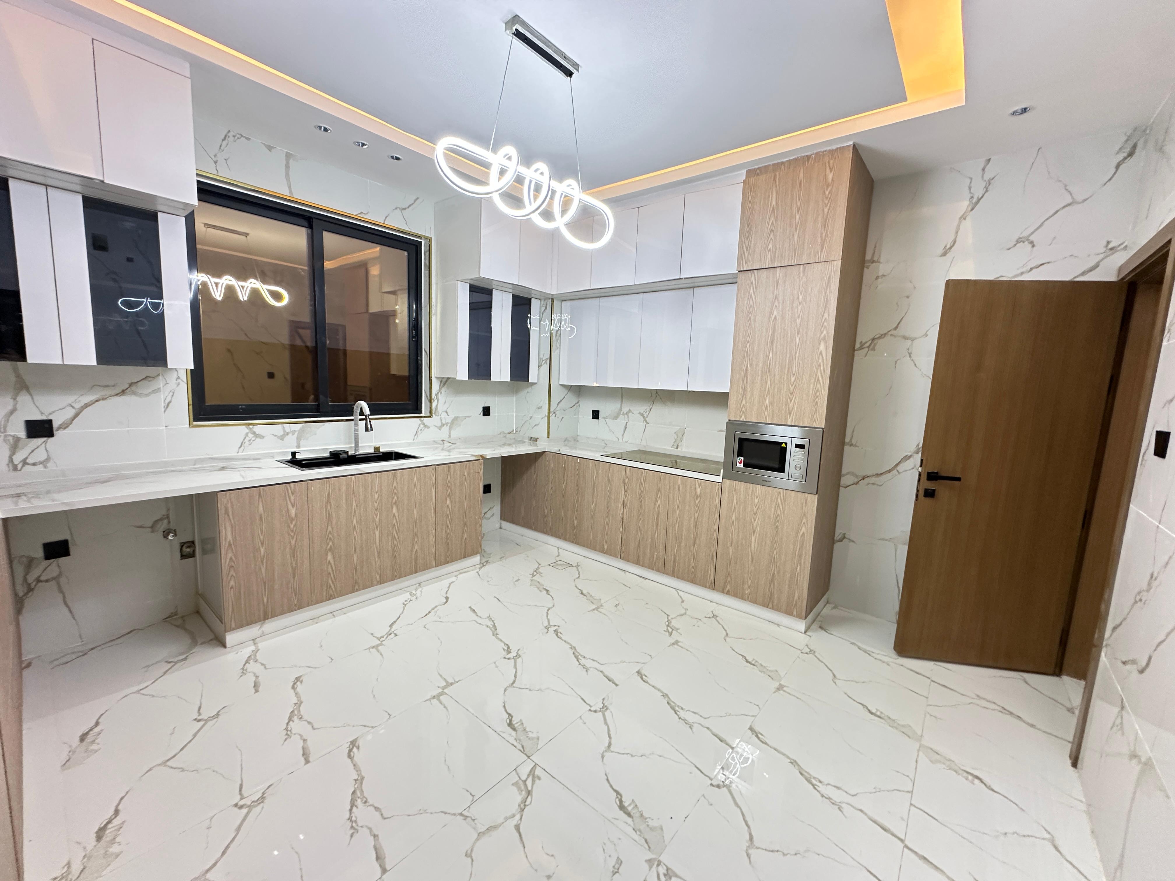 For sale: A distinctive villa with a full stone façade in the Al Zahia area. 13