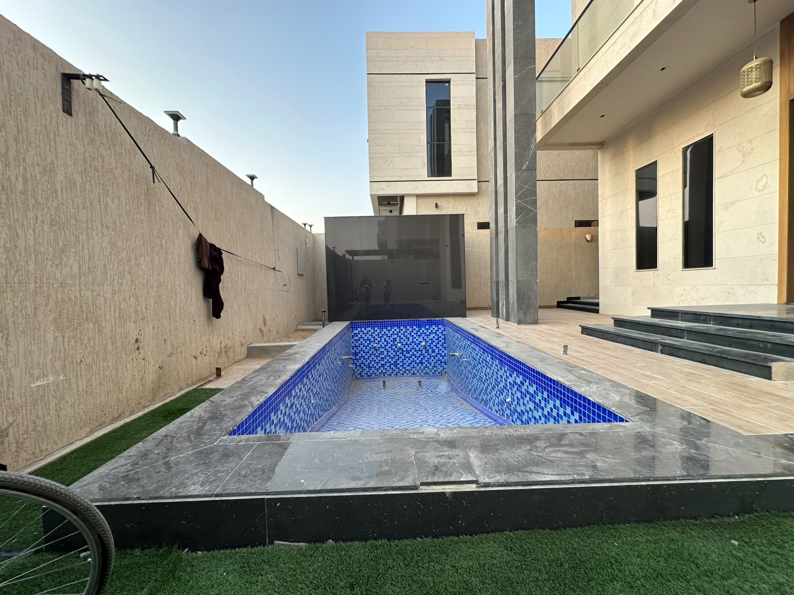 Modern villa for sale in Al Zahia with a private pool; registration fees included. 4
