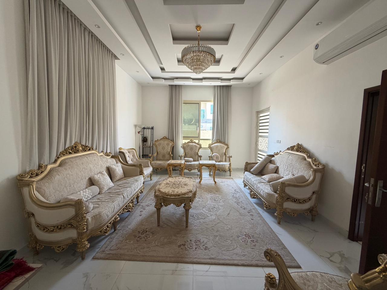 Furnished villa for sale in Al Yasmin area, including air conditioning, electricity, and water.