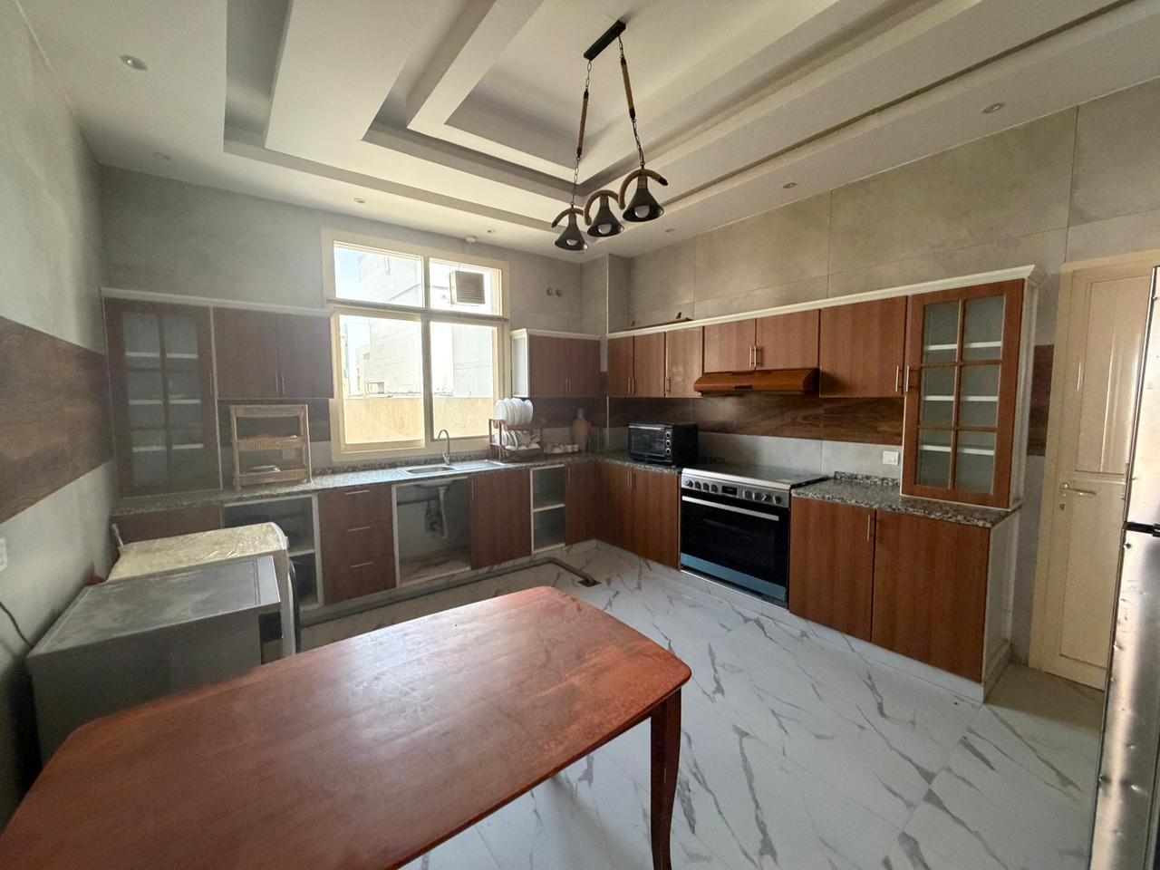 Furnished villa for sale in Al Yasmin area, including air conditioning, electricity, and water. 4