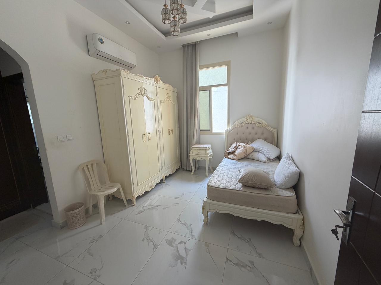 Furnished villa for sale in Al Yasmin area, including air conditioning, electricity, and water. 8