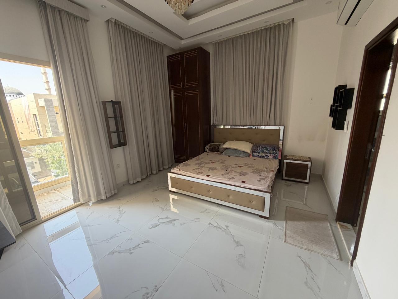 Furnished villa for sale in Al Yasmin area, including air conditioning, electricity, and water. 12