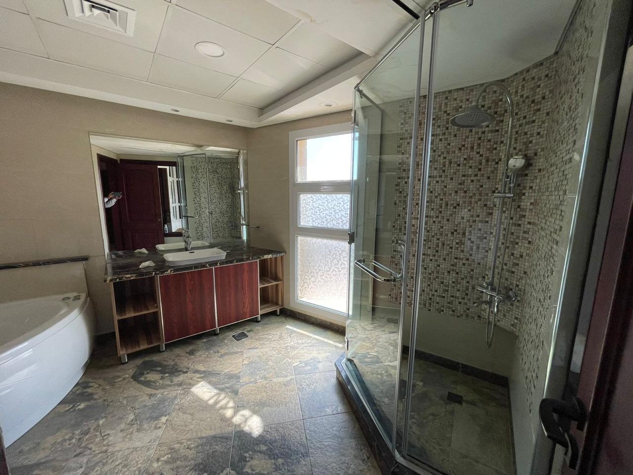 Corner villa for sale in Dubai Land area at a bargain price 10