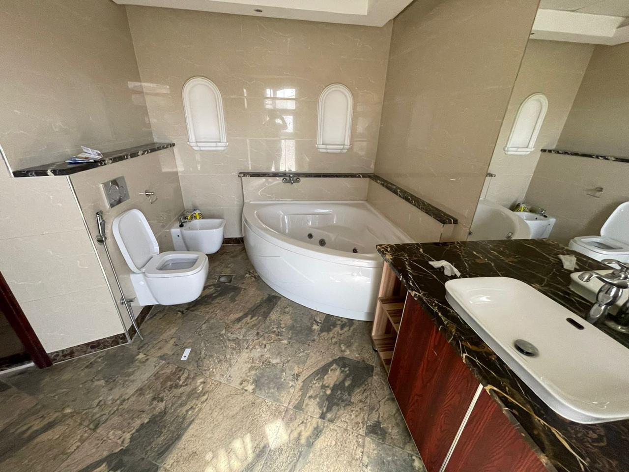 Corner villa for sale in Dubai Land area at a bargain price 12