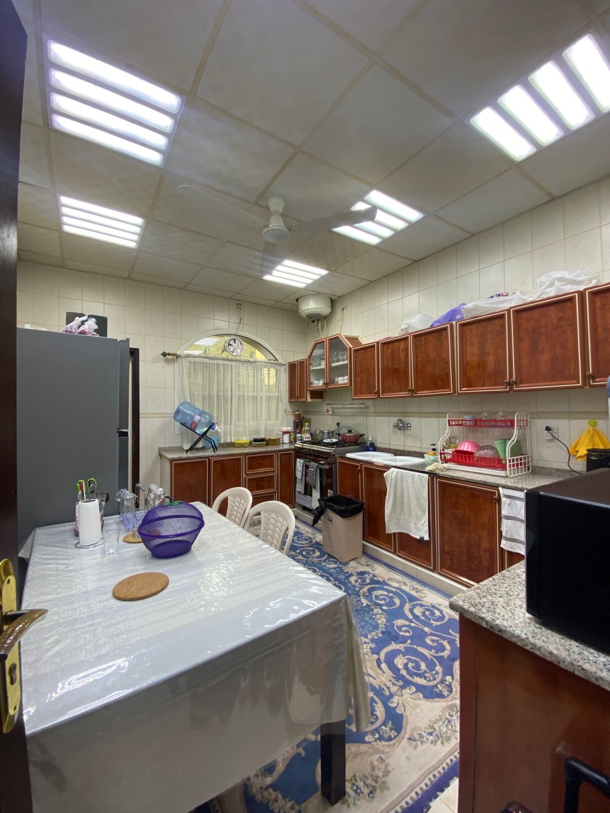 Furnished villa for sale in Al Rawdah; price includes water, electricity, and air conditioning. 12