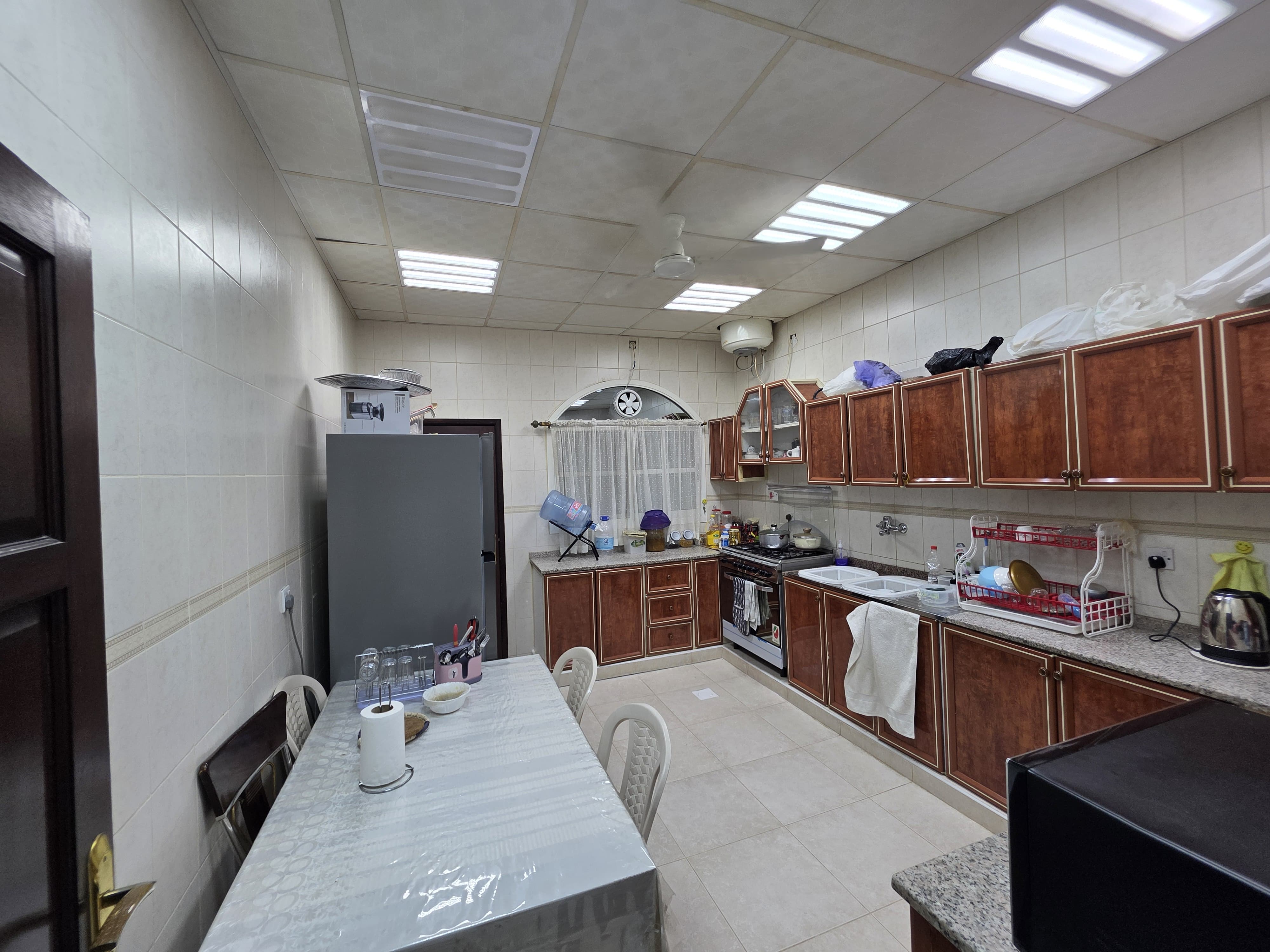 Furnished villa for sale in Al Rawdah; price includes water, electricity, and air conditioning. 15