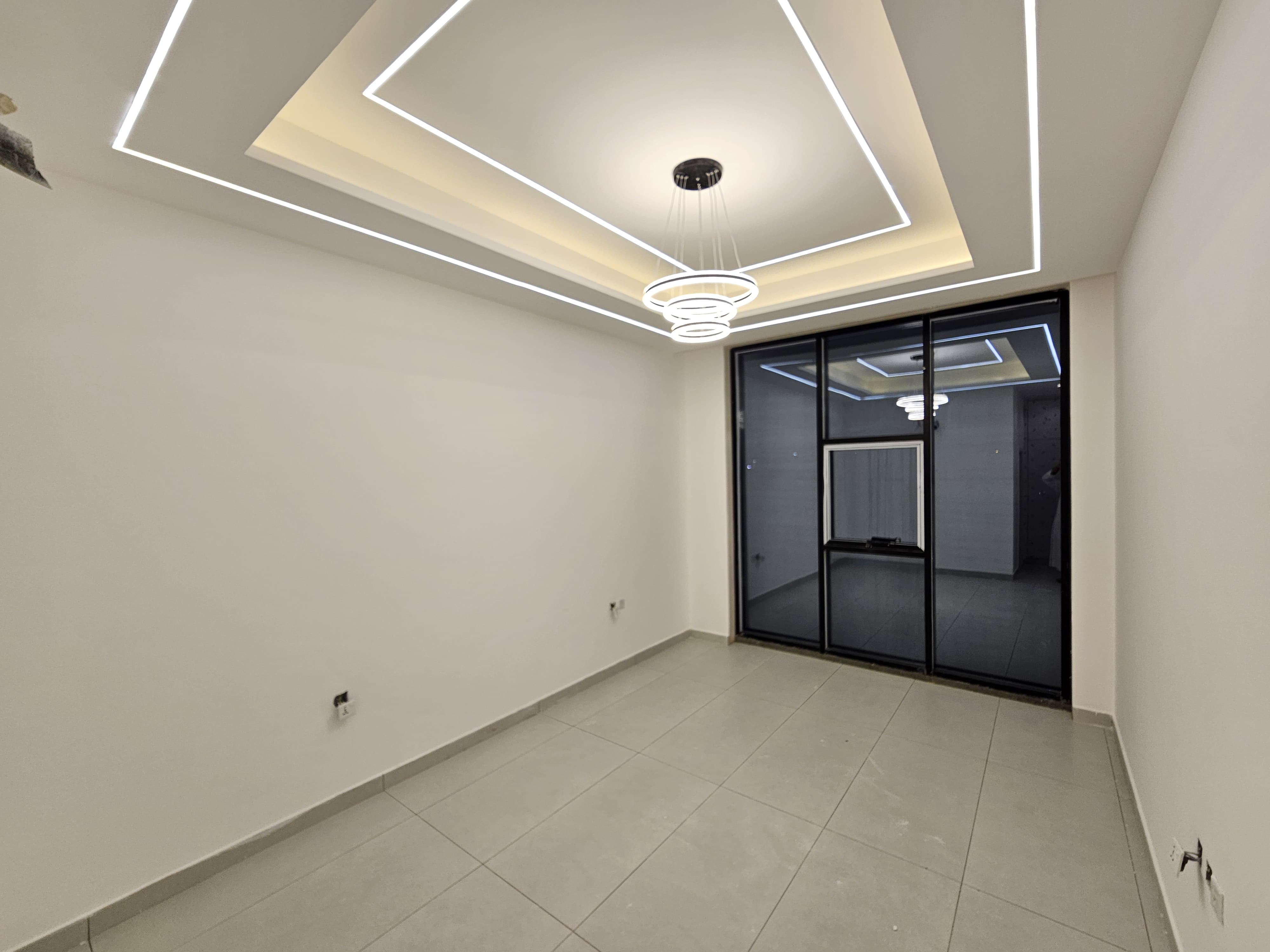 A residential villa is available on Al Zubair Street in Al Helio/2. It features luxurious modern finishes, natural stone and marble facades, distinctive lighting, and an interior design comprising a majlis, bathroom, washrooms, a large kitchen, a living room with a bathroom, four spacious master bedrooms with built-in wardrobes, and a balcony. The land area is 160 square meters (1722 square feet), and the built-up area is 3000 square feet (265 square meters). Registration and ownership fees are included. The asking price is AED 1,270,000. 2