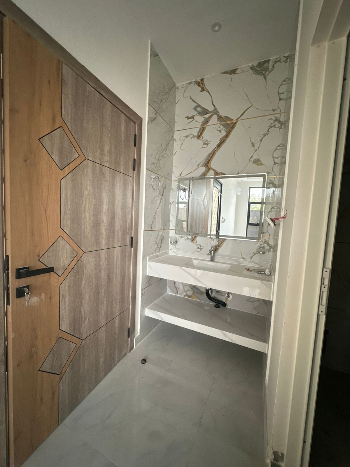 A residential villa is available on Al Zubair Street in Al Helio/2. It features luxurious modern finishes, natural stone and marble facades, distinctive lighting, and an interior design comprising a majlis, bathroom, washrooms, a large kitchen, a living room with a bathroom, four spacious master bedrooms with built-in wardrobes, and a balcony. The land area is 160 square meters (1722 square feet), and the built-up area is 3000 square feet (265 square meters). Registration and ownership fees are included. The asking price is AED 1,270,000. 8