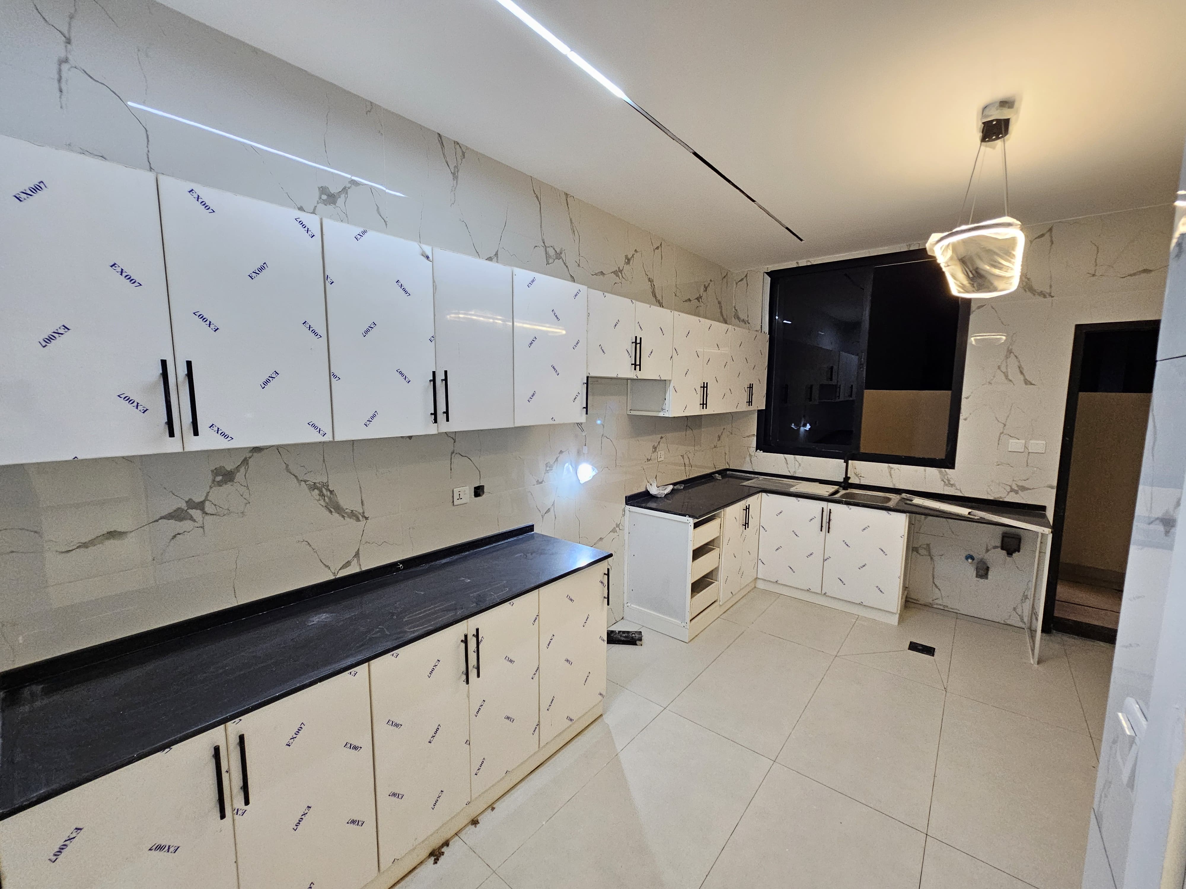 A residential villa is available on Al Zubair Street in Al Helio/2. It features luxurious modern finishes, natural stone and marble facades, distinctive lighting, and an interior design comprising a majlis, bathroom, washrooms, a large kitchen, a living room with a bathroom, four spacious master bedrooms with built-in wardrobes, and a balcony. The land area is 160 square meters (1722 square feet), and the built-up area is 3000 square feet (265 square meters). Registration and ownership fees are included. The asking price is AED 1,270,000. 9