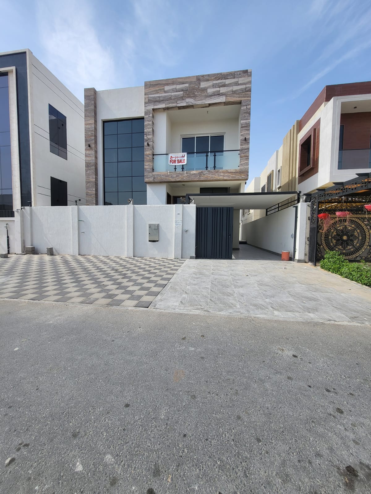 Villa for sale in Al Yasmin neighborhood, Ajman, with a modern design and distinctive features.